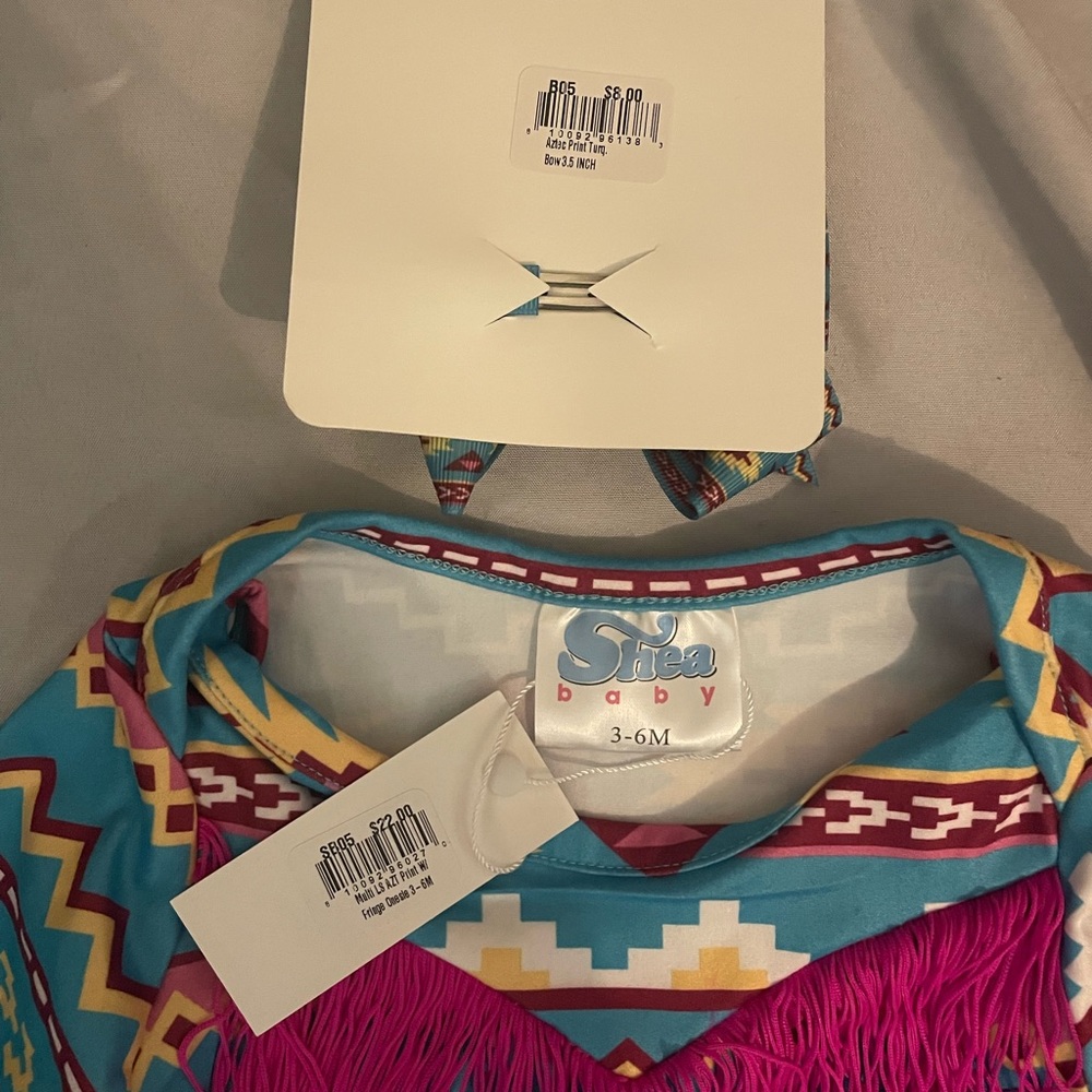 3-6 month onesie and bow clip. FITS LIKE 6-9 month. NWT